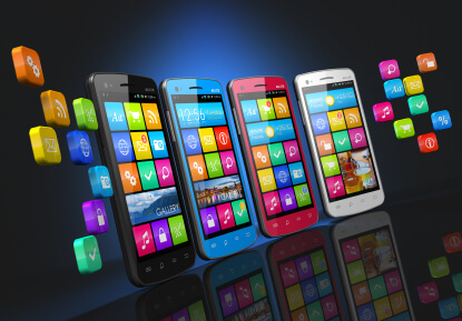 Row of 4 touchscreen smartphones with application icons showing on screens and floating on each side of the row.