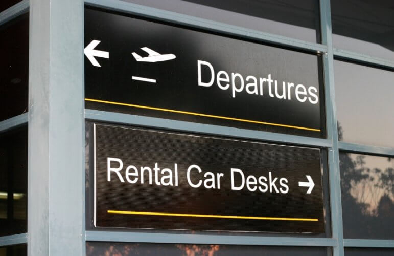 Photography of airport signs reading 