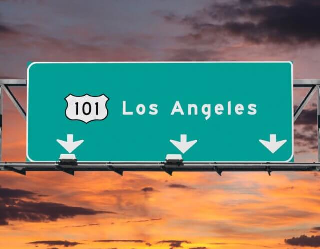 101 Hollywood Freeway road sign in Los Angeles with sunrise sky in background