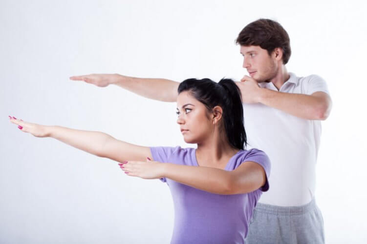 A young couple doing tai-chi as exercise