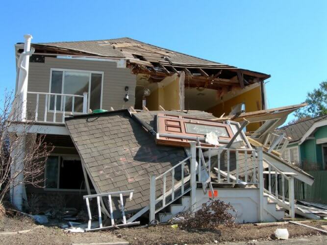 Photography of a house that was destroyed by an earthquake