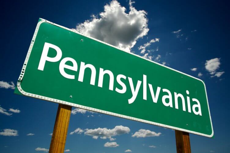 Pennsylvania Road Sign with cloudy blue sky as background
