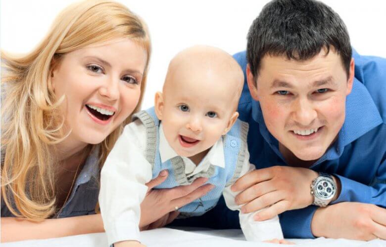 Photography of happy new parents with their smiling toddler because they have life insurance