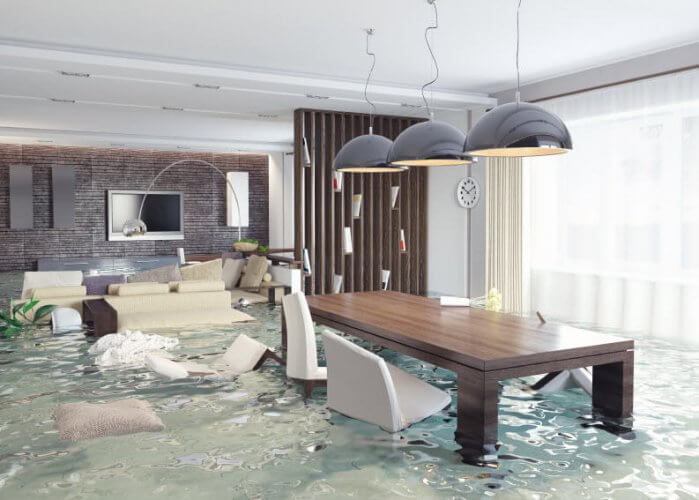 Inside of a luxurious house with Flood Insurance with badly flooded living room and bedroom to depict millions of homes at risk for storm damage.