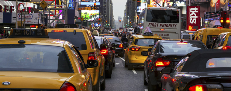 Picture of traffic in the Bronx with many cars, cabs and trucks to illustrate New York auto insurance