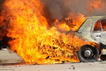 Image of a Two Cars Burn in the Aftermath of Fatal Accident on 60 Freeway