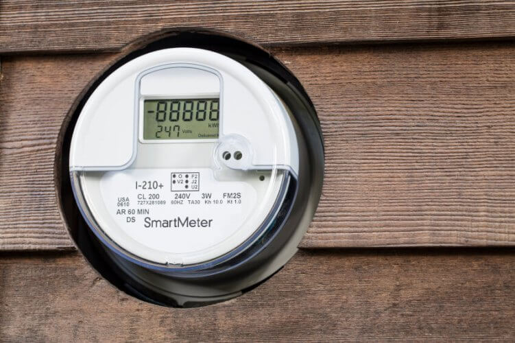 Smart-meter installed in wooden wall to illustrate power usage