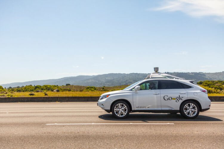 Google self-driving car on an empty road side picture.