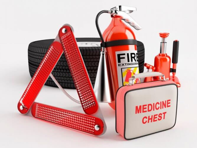 Set of basic necessities during car accident: triangle reflector, medicine chest, fire extinguisher, spare tire, hydraulic jack