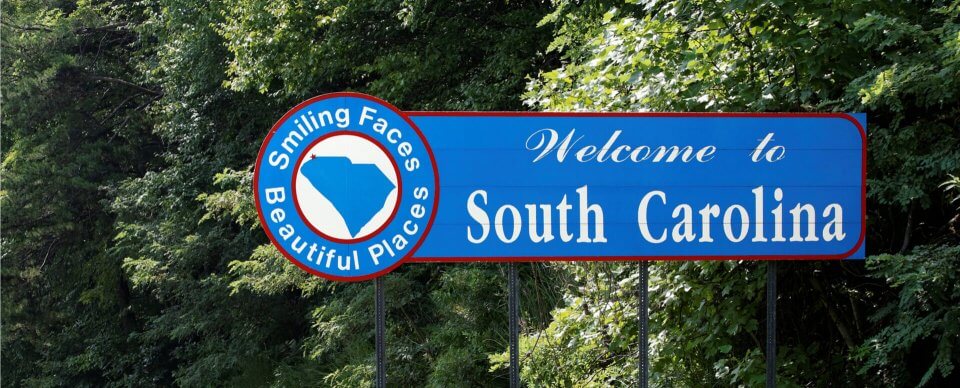 A road sign that reads Welcome to South Carolina to depict the car insurance requirements and coverage in South Carolina.