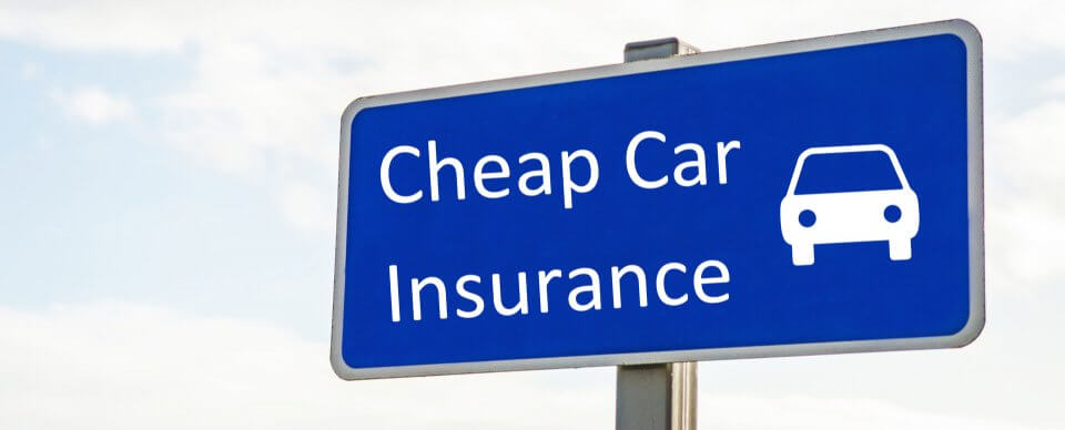 A road sign that reads cheap car insurance to illustrate 10 secrets to cheaper auto-insurance