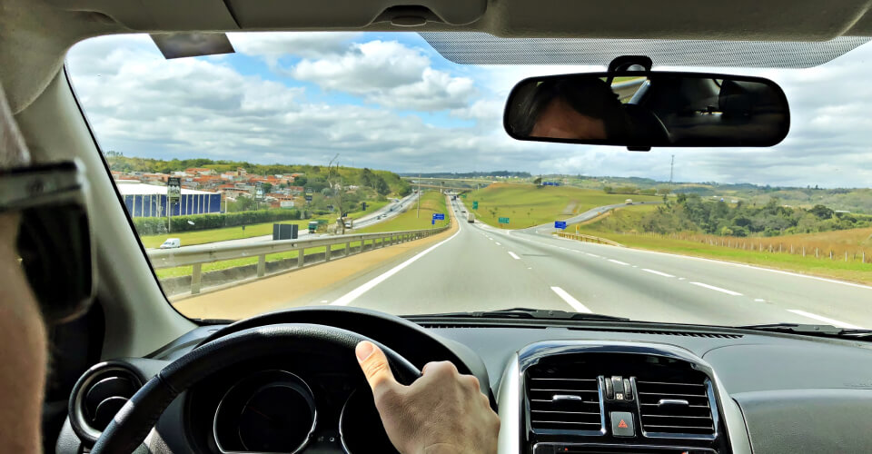 Point-of-view of a driver driving down a highway to illustrate whether your vehicle is a safety hazard on the road