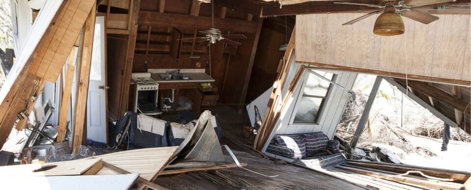 Panoramic view of a house that was destroyed by a hurricane to show people helpful tips before and after a hurricane.