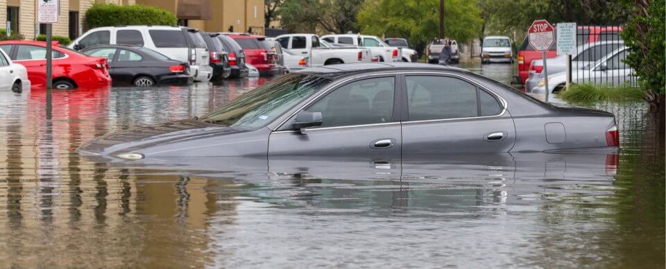 A car that was covered with water after a flood to illustrate whether a car is covered if it is damaged or totaled in a flood.