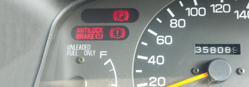 A Close up of anti-lock brake light on a car's dashboard to illustrate how to use anti-lock brakes