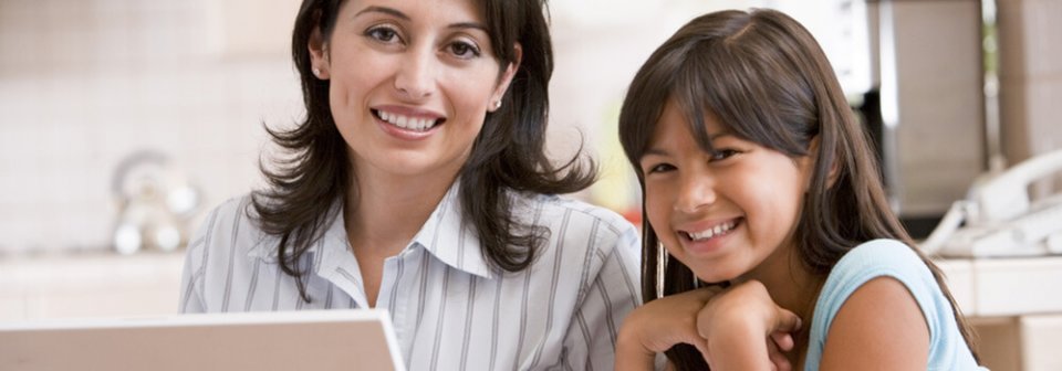 Mother and daughter shopping for health insurance online and illustrating some tips for buying your own health insurance