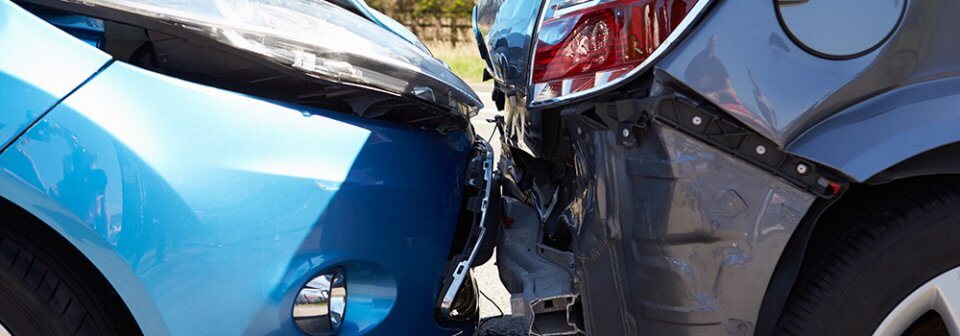 Close up of a minor crash between two vehicles to illustrate how does car insurance work.