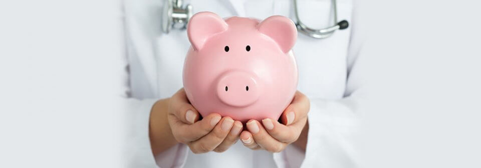 A health worker holding a piggy bank to depict how to keep health care costs low