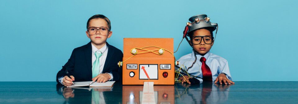 A Caucasian child performing a lie detector test to an African-American child and illustrating reasons not to lie to your insurance company.