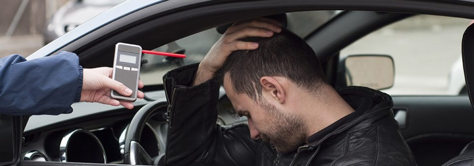 A young latino man who just failed a breathalyzer test and portrays various ways to prevent drinking and driving