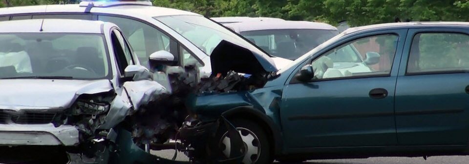 A serious accident in which a sedan t-boned another sedan that illustrates what to do in case of a serious accident.