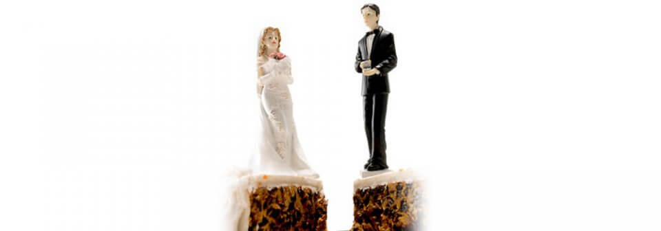 Two wedding cake figurines placed on different pieces of cake to illustrate how single, widowed or divorced pay more for car insurance.