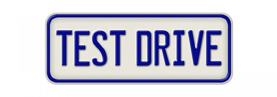 A metal plate that reads test drive to depict how will car insurance cover damage I cause on a test drive.
