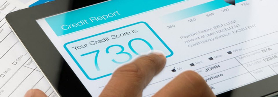 A tablet showing data about somebody's credit report to depict how credit scores affect insurance rates.