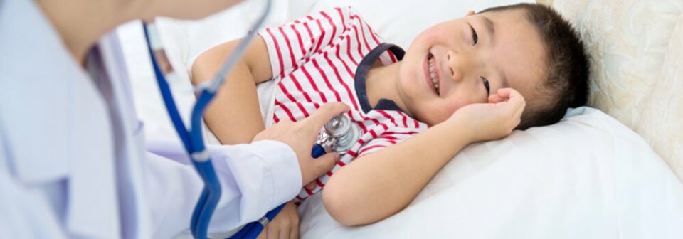 A young child receiving medical care to depict four questions to ask when choosing a family doctor in California.