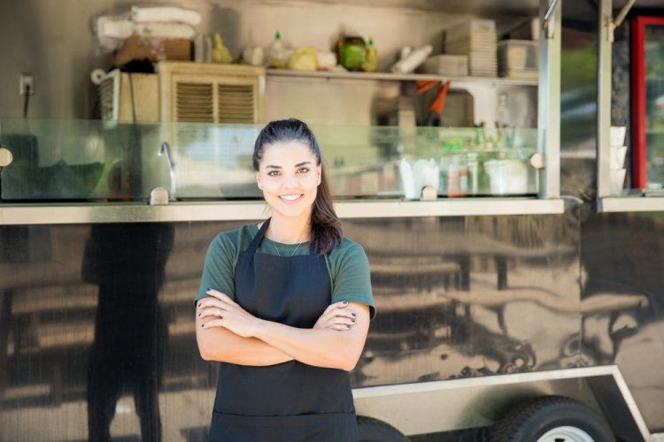young food truck owner posing for photo