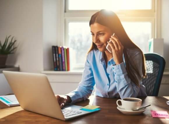 women talking on the phone and working from home during coronavirus