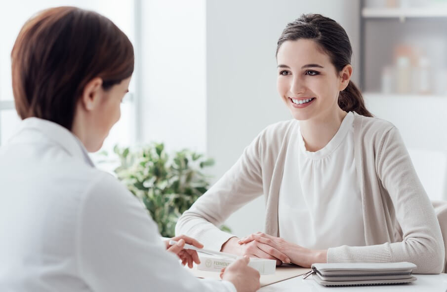 female doctor talking to patient during california open enrollment extension