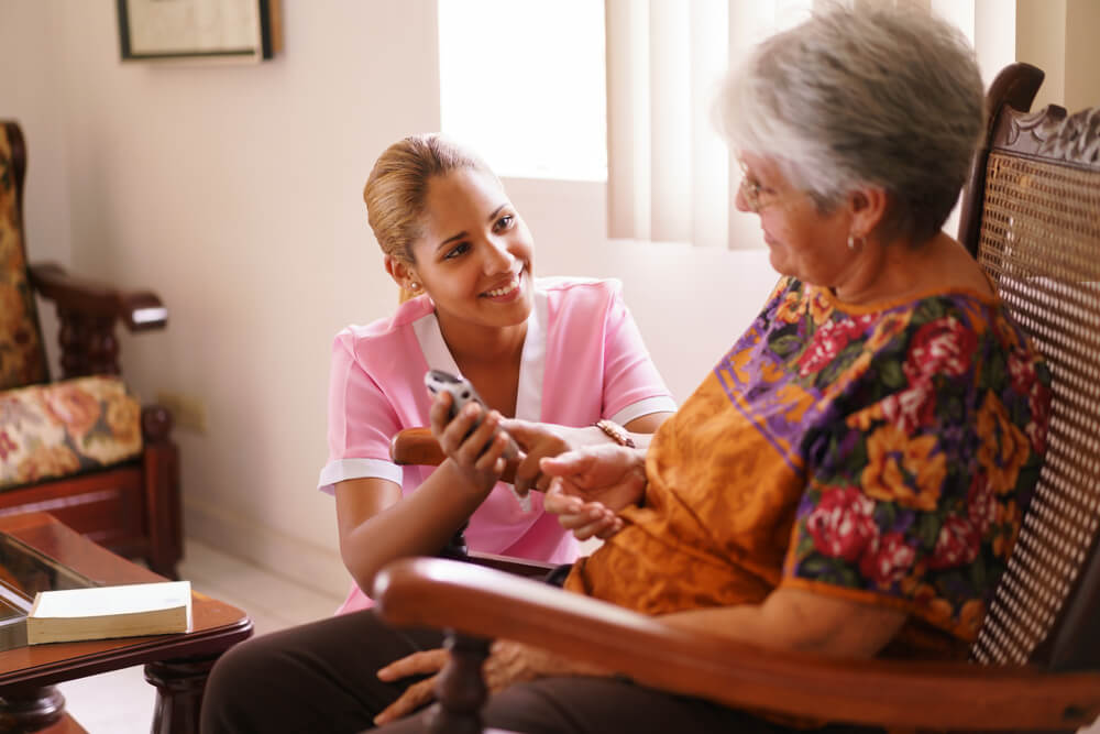 elderly woman with nurse in her house with in home senior care