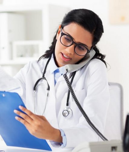 A female hispanic physician doing a telemedicine call with a patient to illustrate what is telemedicine