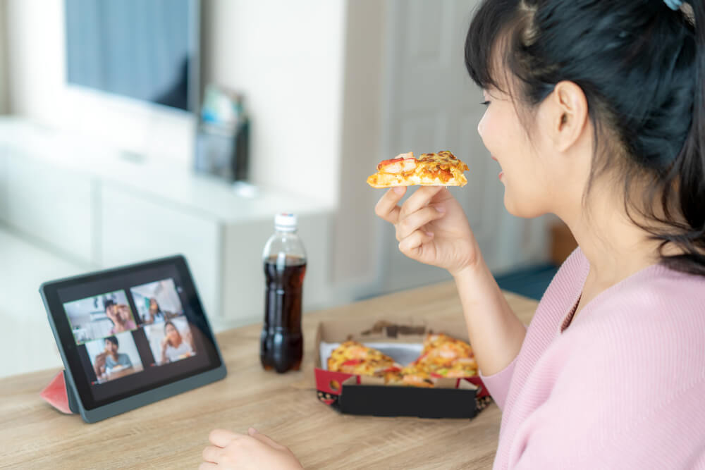 woman having an online party with family during quarantine