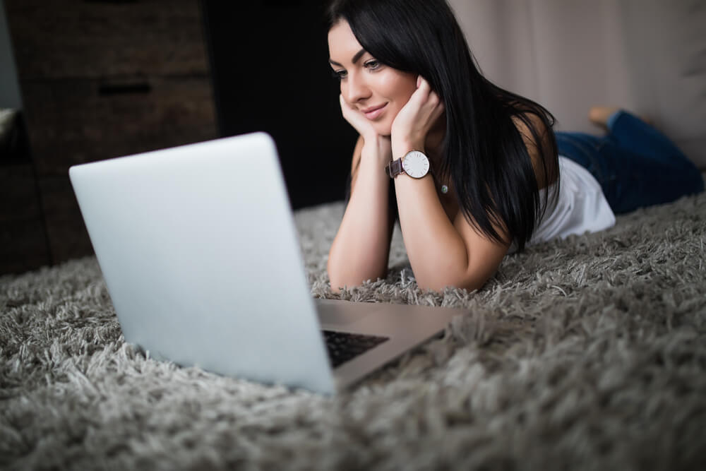 woman having a watch party with family while social distancing