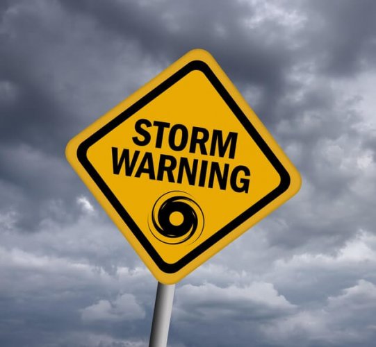 A road sign that reads storm warning to depict how to prepare for a tornado