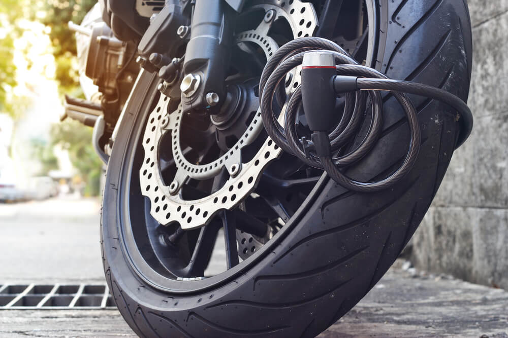 motorcycle with an anti theft lock installed on wheel