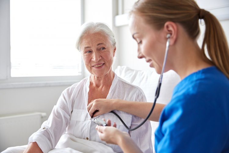 elderly woman with nurse