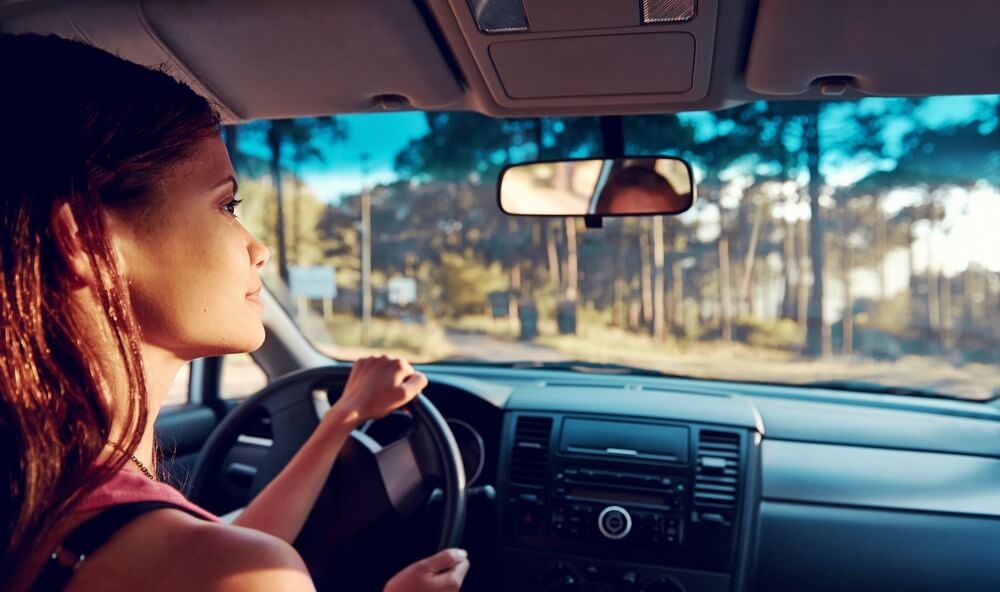 hispanic woman driving an automatic car