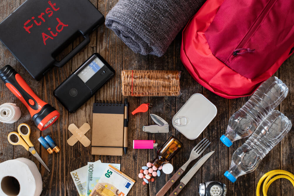 tornado prepardness kit with water, radio, flashlight, and several emergency supplies