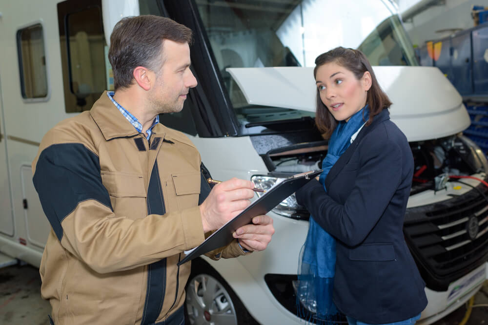 woman buying a used camper with a car license 