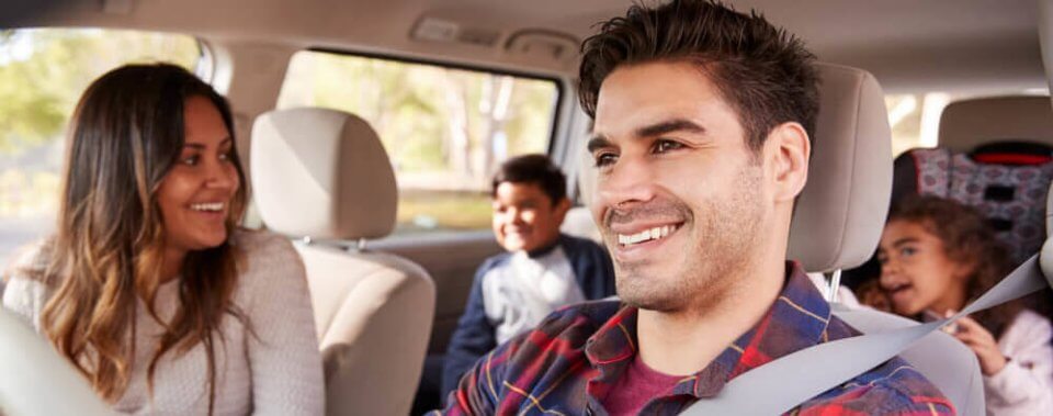 family riding inside in car with insurance