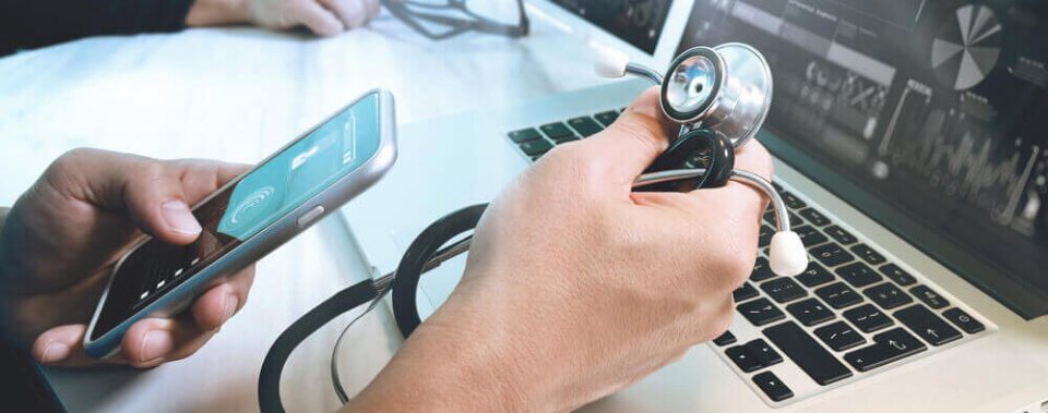 doctor in front of laptop using medical tortillas