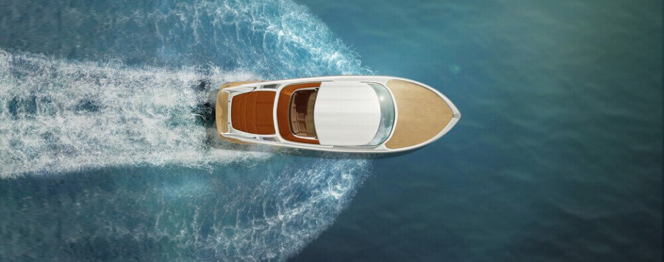 aerial view of a boat running through water with insurance