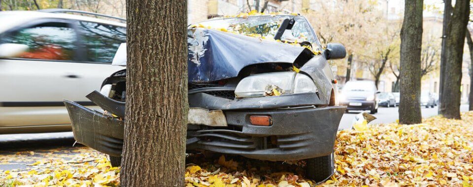 car crashed into a tree with property damage insurance