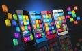 Row of 4 touchscreen smartphones with application icons showing on screens and floating on each side of the row.