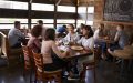 A group of friends gather for lunch together at a restaurant.