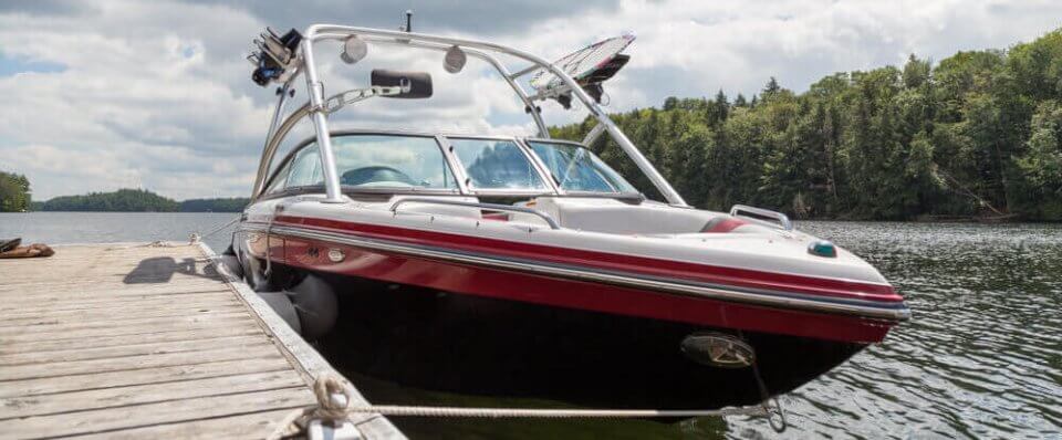 docked boat at lake with boat insurance