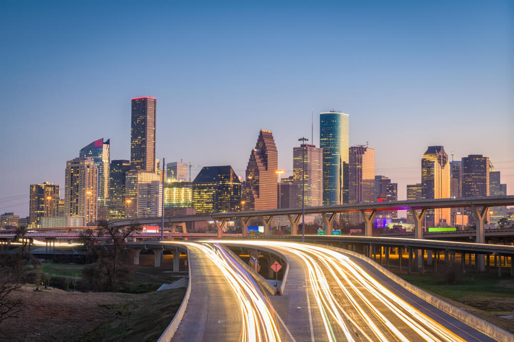 aerial view of a texas highway at sunset with cars with comprehensive insurance